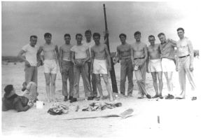 [ Ace with guys on the beach ]