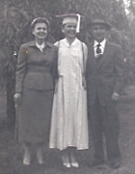 [ Graduating Christine with her parents in 1956 ]